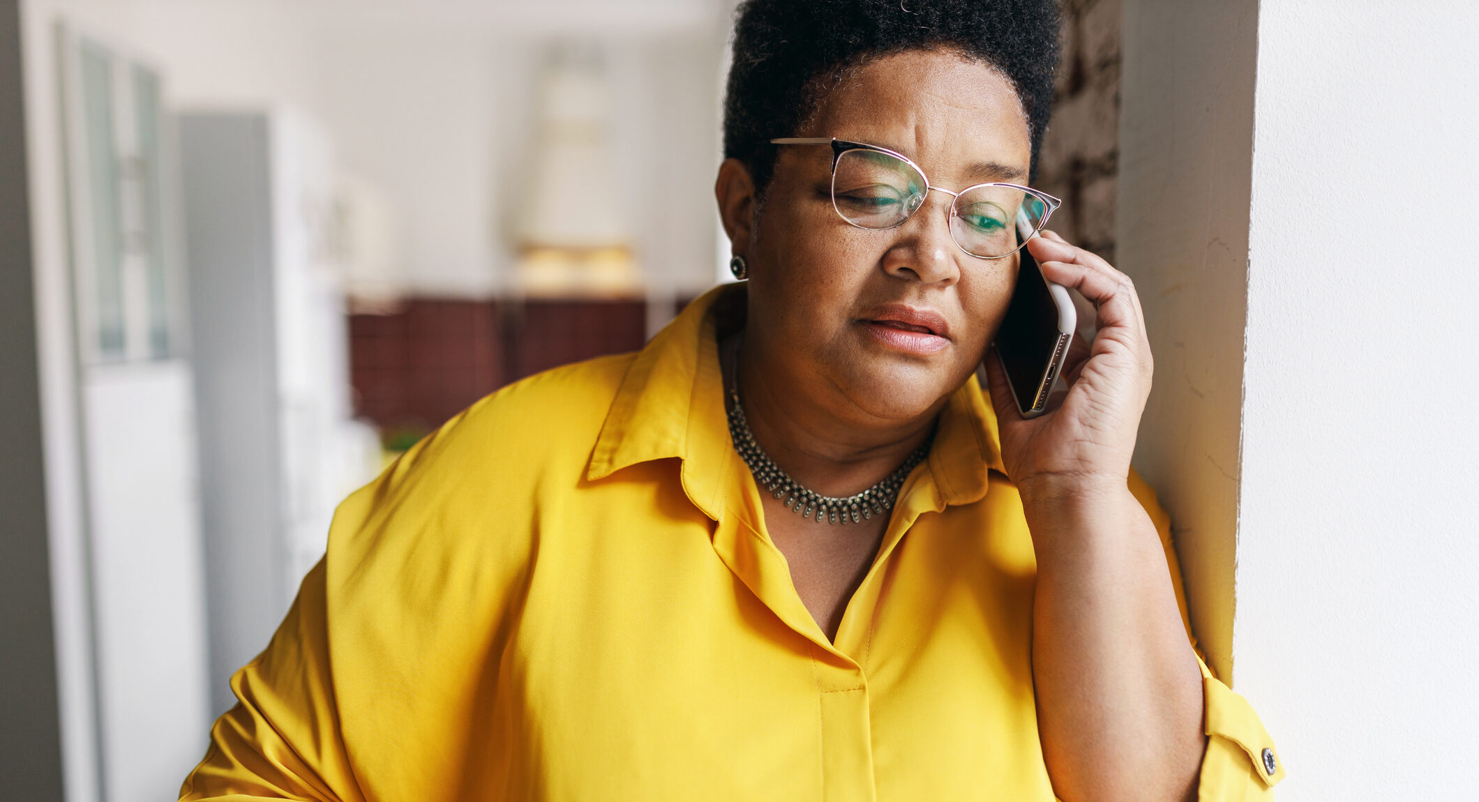 Older woman on the phone with her insurance company