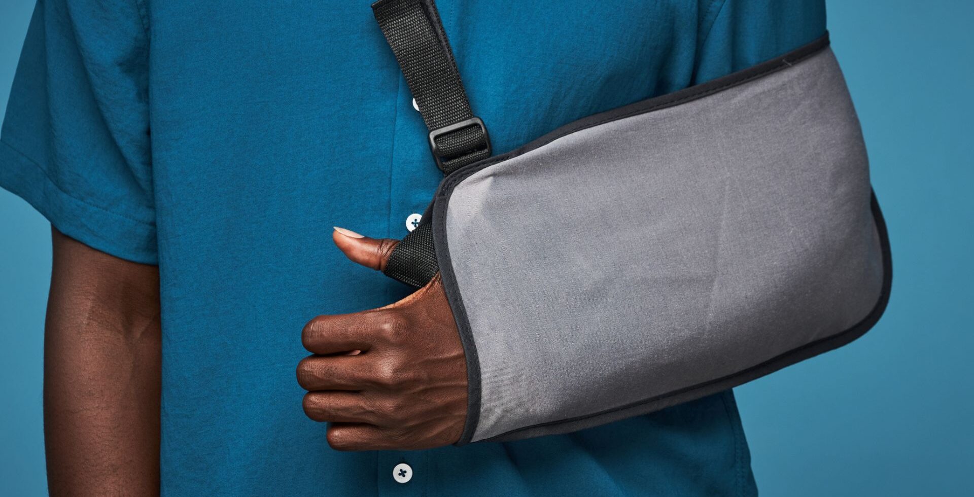 man with broken arm in sling