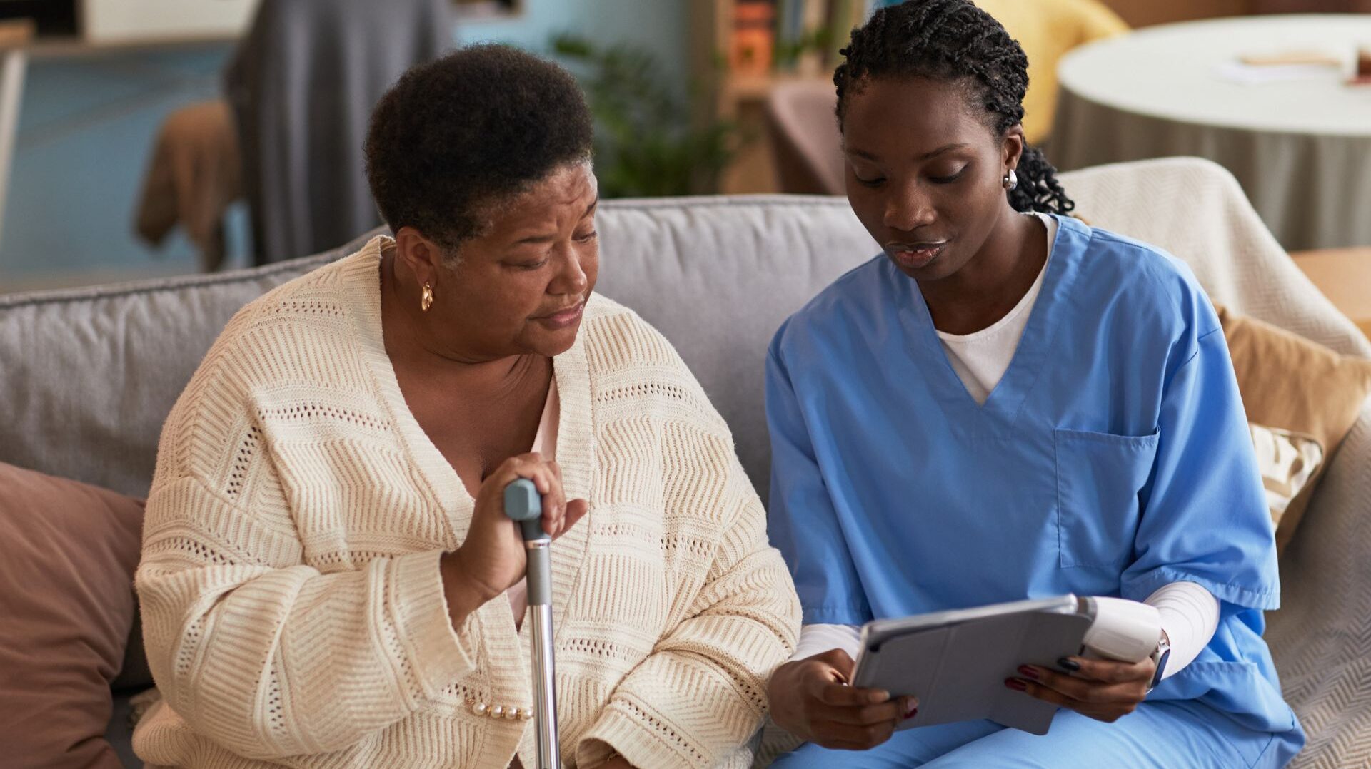 older woman with nurse discussing health condition