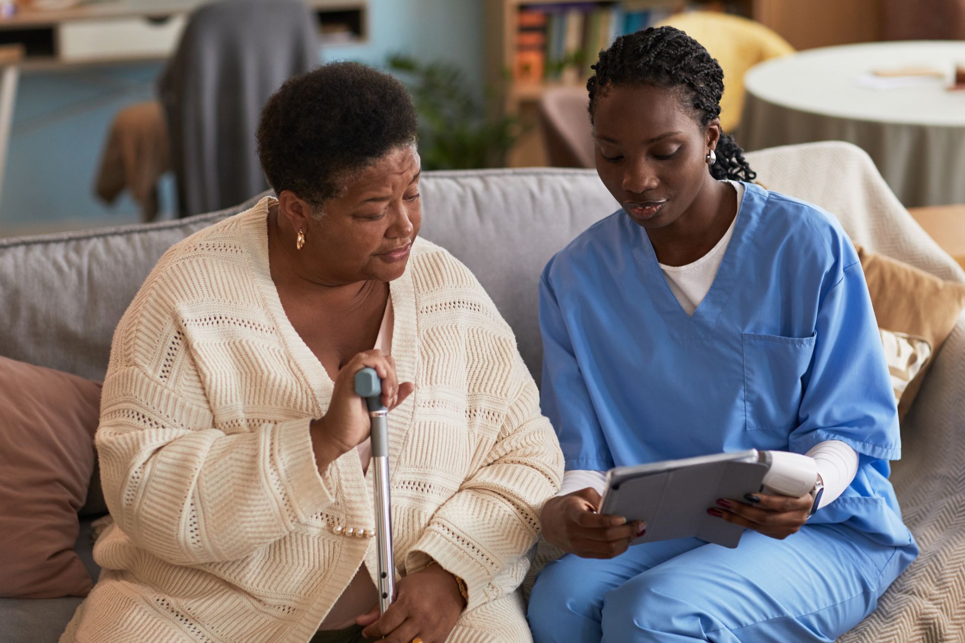 older woman with nurse discussing health condition