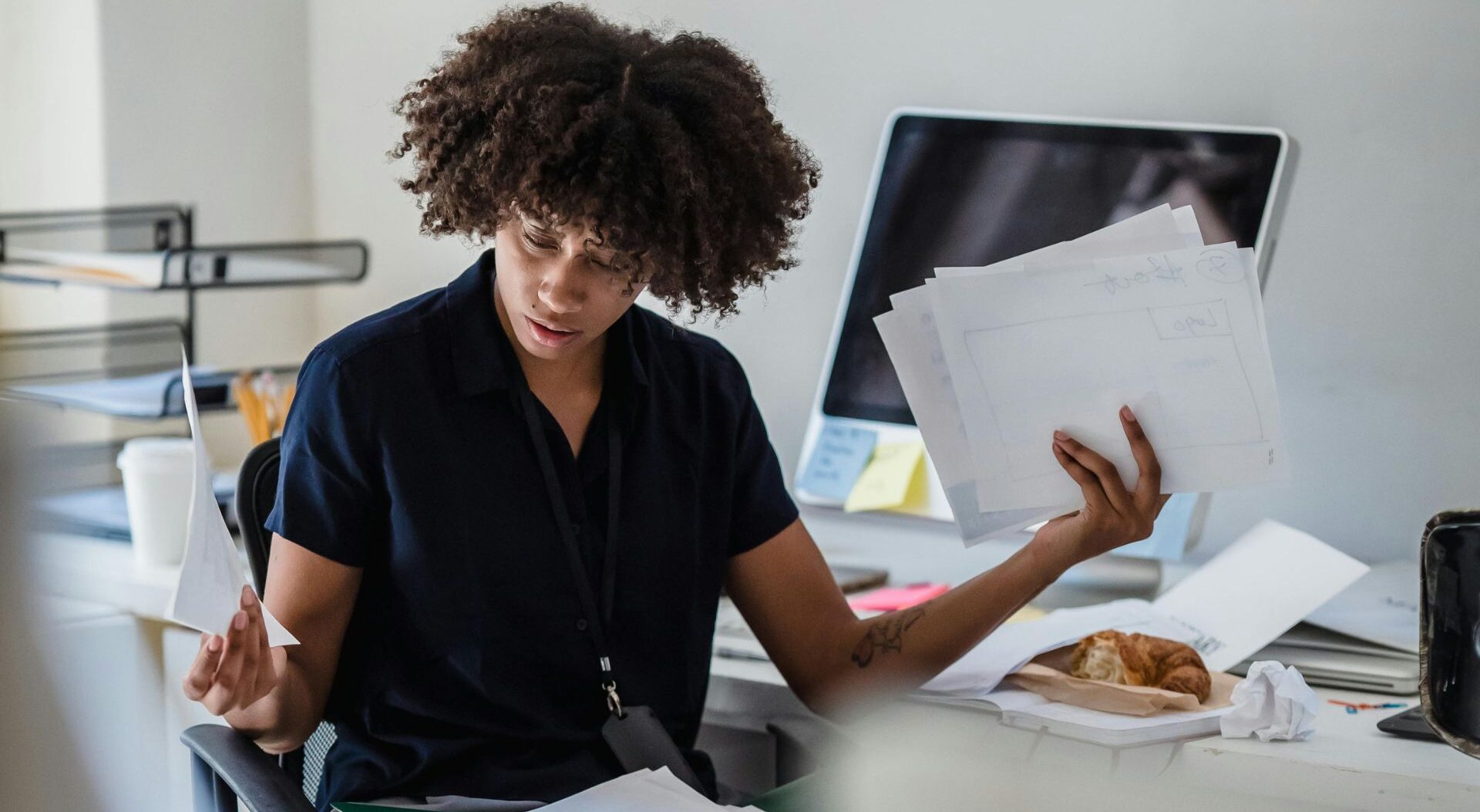 Woman confused by complicated insurance paperwork