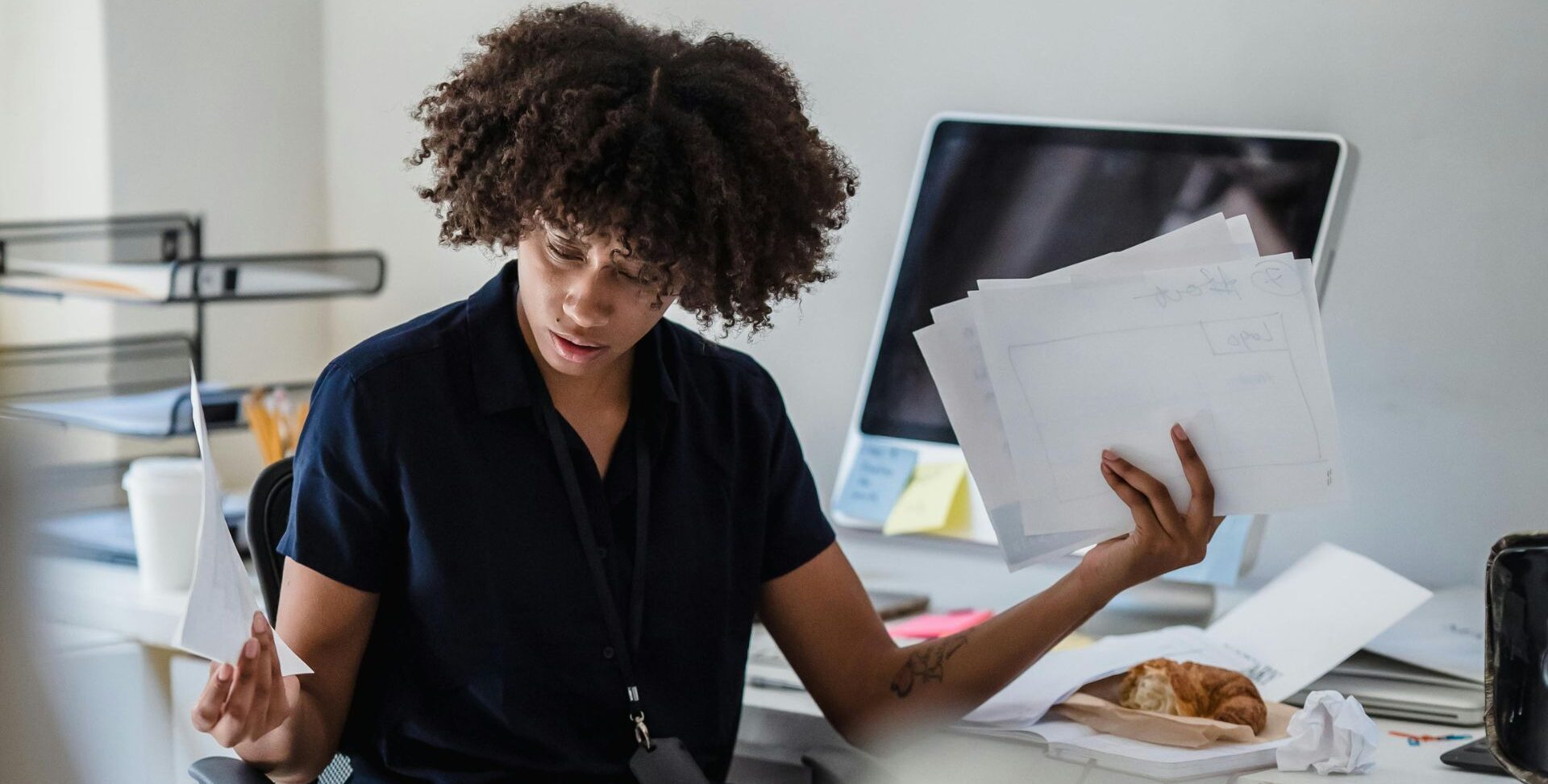 Woman confused by complicated insurance paperwork