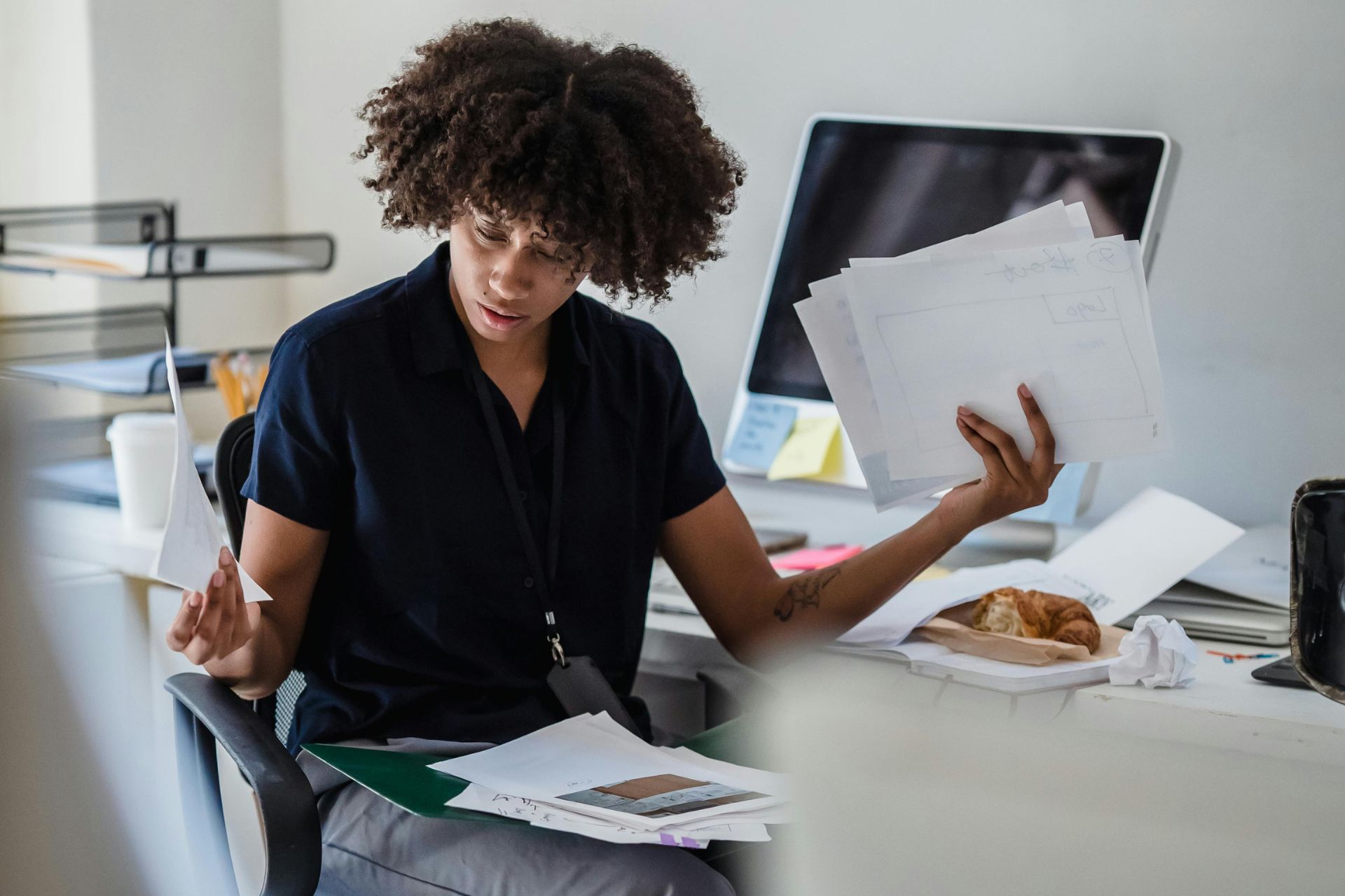 Woman confused by complicated insurance paperwork